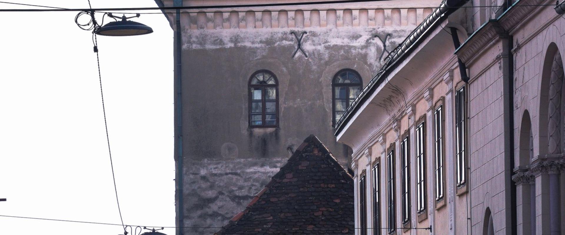 Sunlit street view of historic buildings and architecture in Zagreb, Croatia.